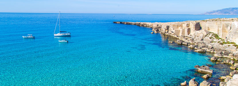 Lagoon with vessels on Favignana island in Sicily, Italy